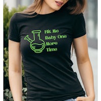 a woman wearing a black t - shirt that says i'm a baby one more time