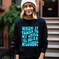 a woman wearing a sweatshirt that says when it comes to my child