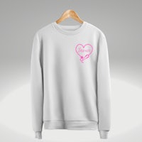 a white sweatshirt with a pink heart on it