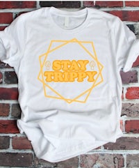 a white t - shirt with the words stay trippy on it