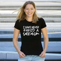 a woman wearing a black shirt that says i have never faced a sexist