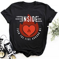 a black t - shirt with a red heart on it that says inside