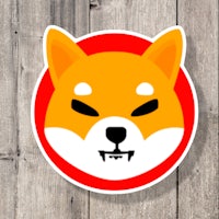 a sticker of a shiba dog on a wooden background