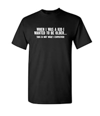 a black t - shirt that says, when i was a kid i wanted to be an idiot