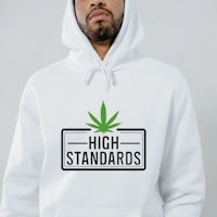 a man wearing a white hoodie that says high standards