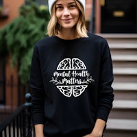 a woman wearing a black sweatshirt that says mental health matters